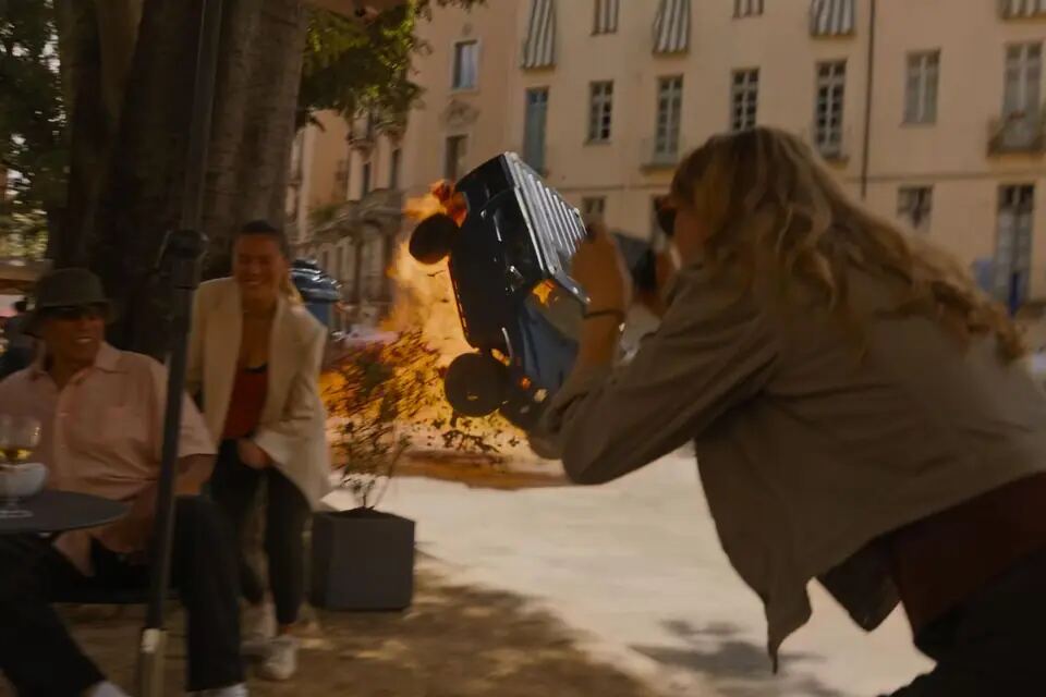 Burning vehicle flips through an outdoor action sequence in Fast X