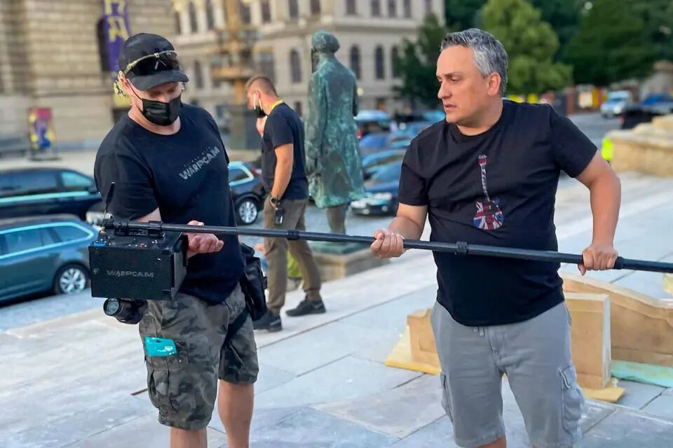 WarpCam® operator and crew member rehearse a pole-camera move on The Gray Man set